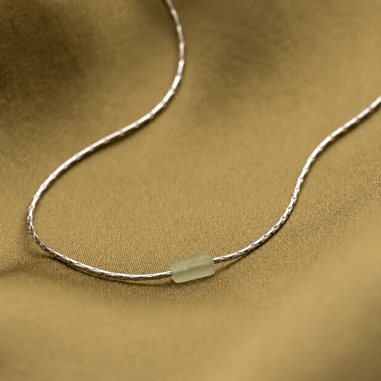 Embrace Serenity and Luck with our Green Crystal Bar Necklace